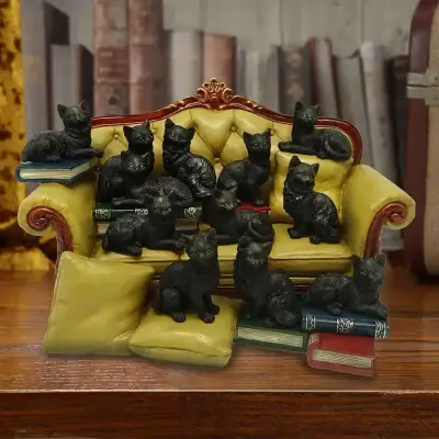 Figurine couch clowder with 48 display cats